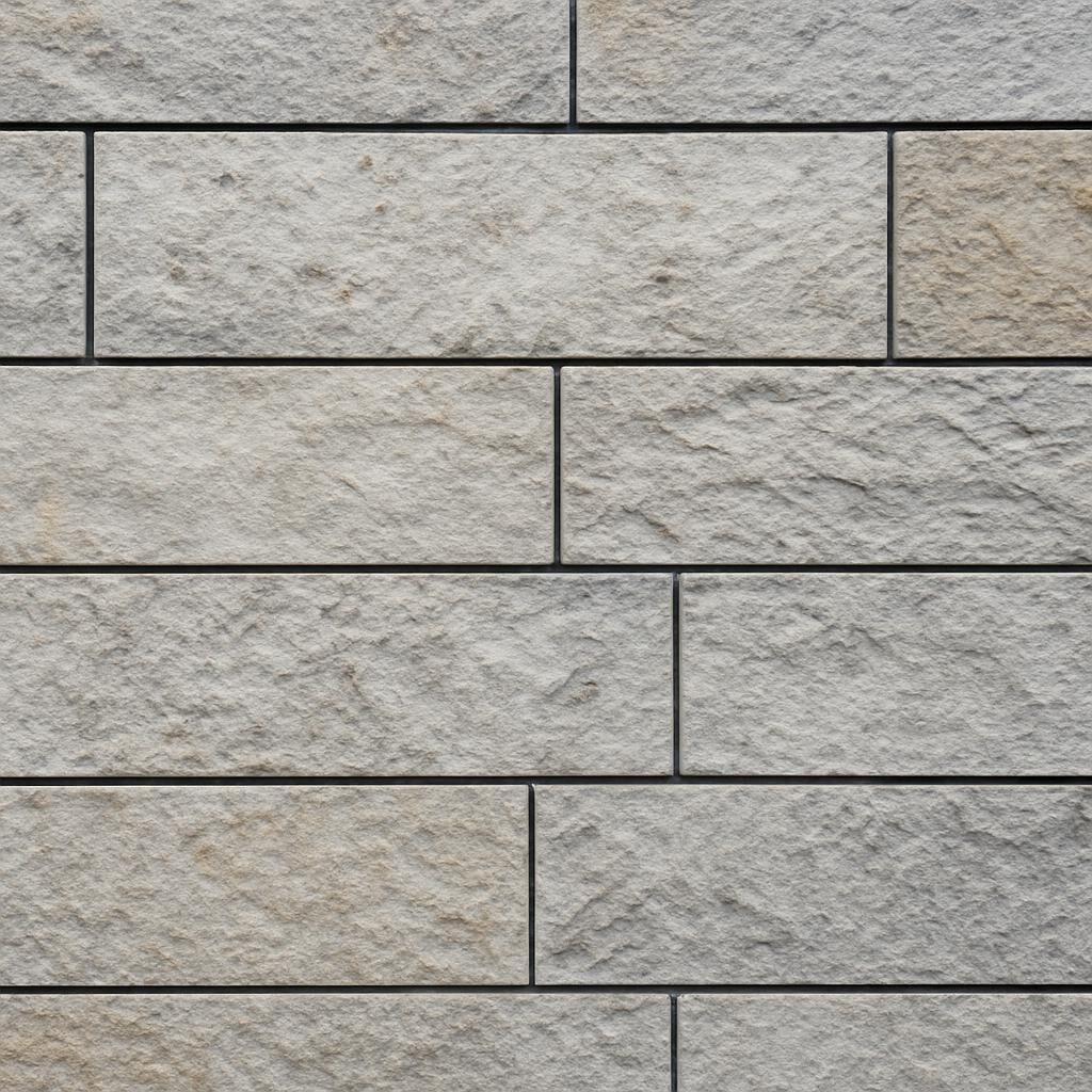 Texture détail panneaux pierre naturelle calcaire sur façade bâtiment